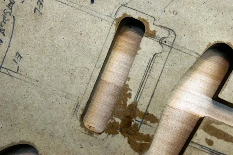 Also check the top tremolo rout position relative to the two marks we made with the awls.