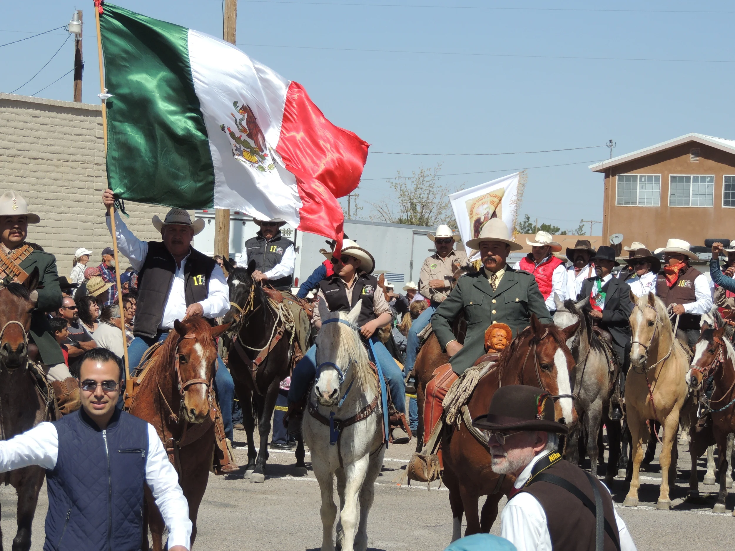 Pancho Villa, flanked by his lieutenants riding into Columbus. To the right of Villa. President Francisco I. Madero.
