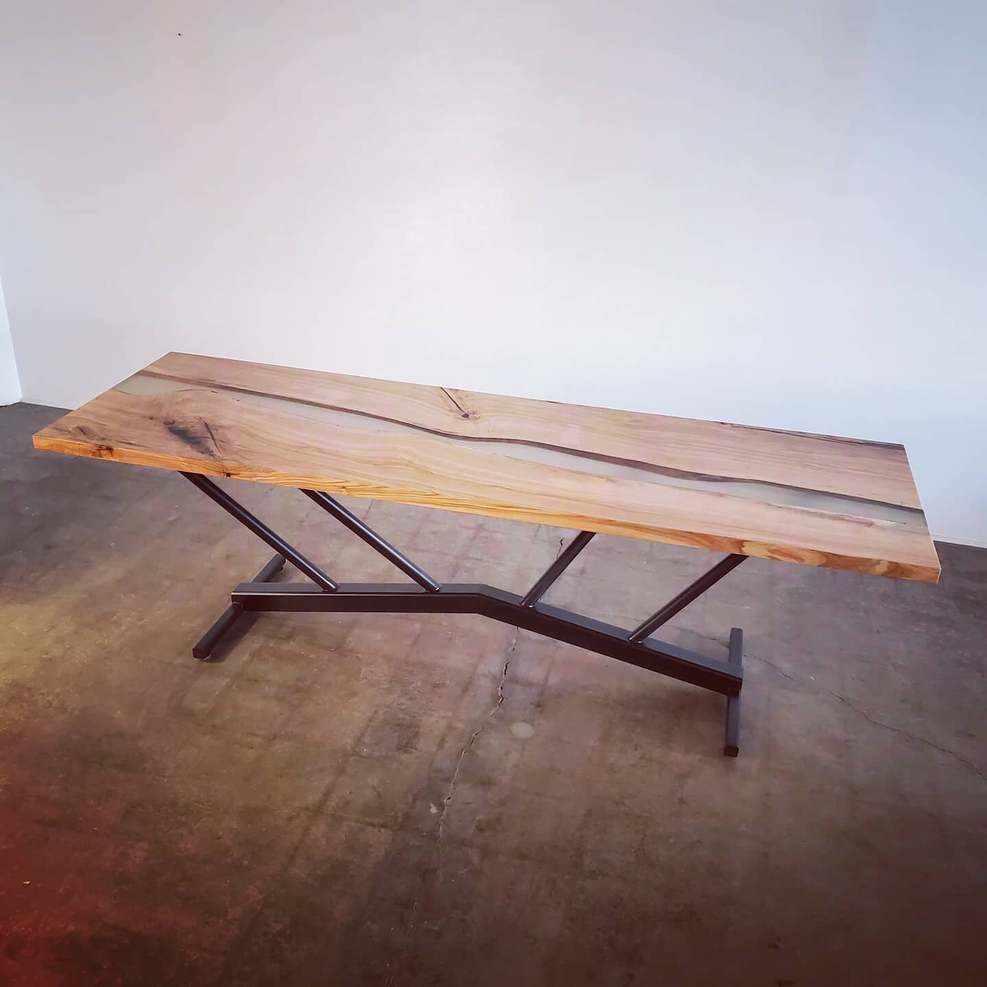 Ash table with resin center fill, blackened steel &quot;bridge&quot; trestle base.