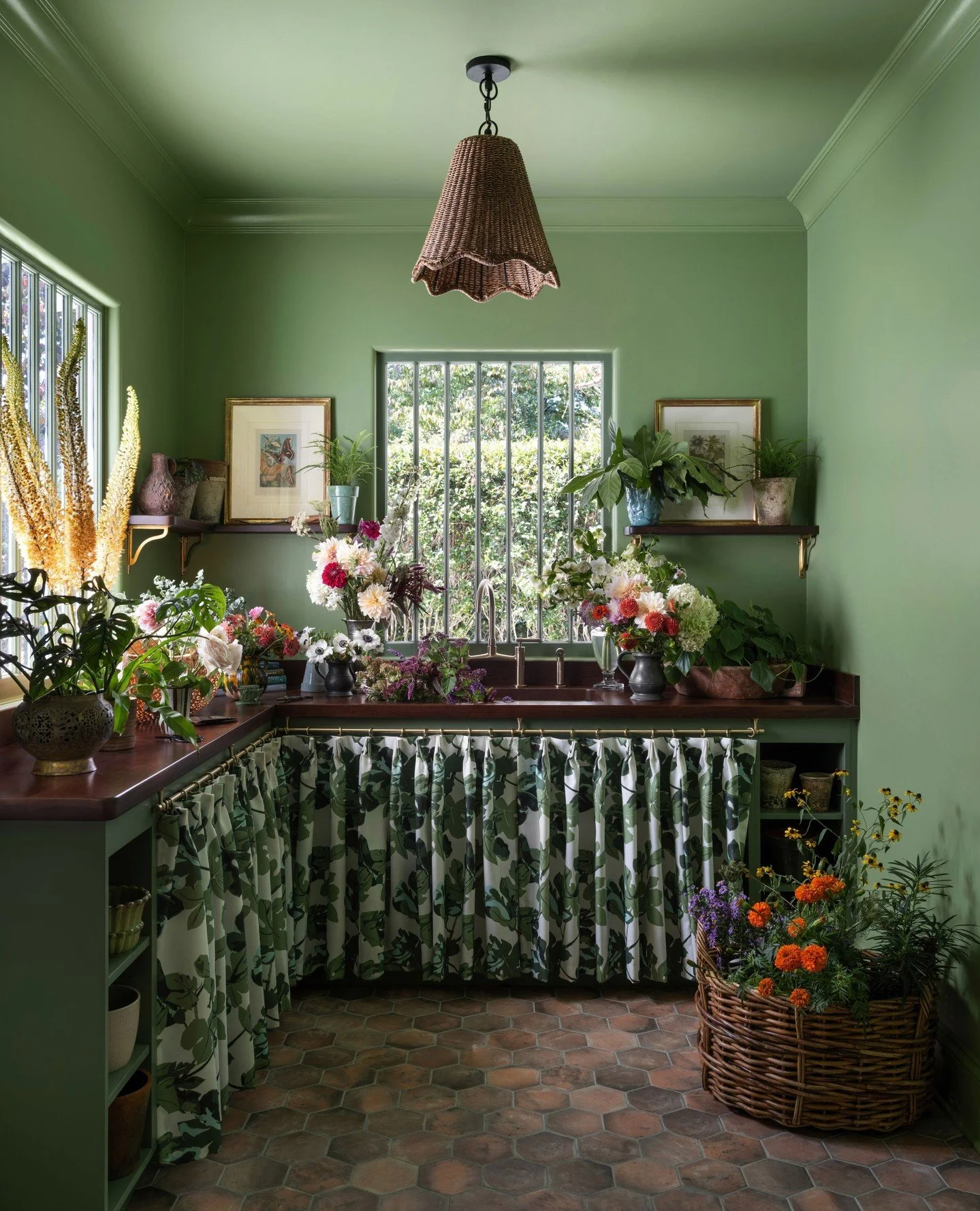 An outdated screened porch at the back of this home was brought back to life and is now a stunning floral arranging room, complete with an adjoining mudroom &mdash; the perfect setup for our garden-loving client. Link in bio to see more from this pro