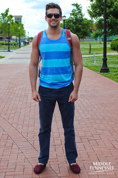 Middle Tennessee State University student wears a summery horizontal stripe two tone blue tank blue chinos and burgundy red toms slippers