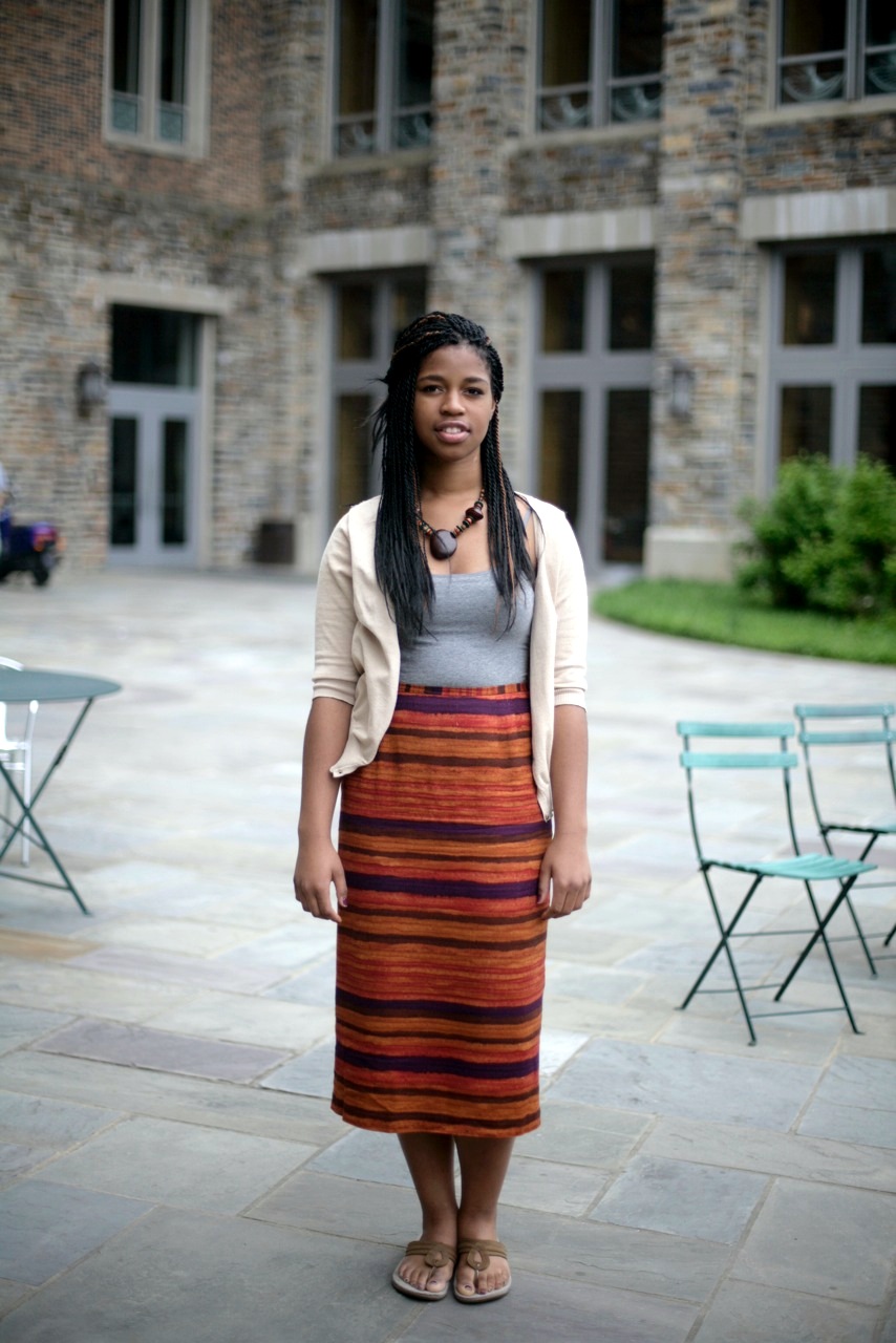 Imani Ifedi, a Duke rising junior is wearing a Bolivian mountain Andes print high waist dress, a grey top and a white lace cardigan
