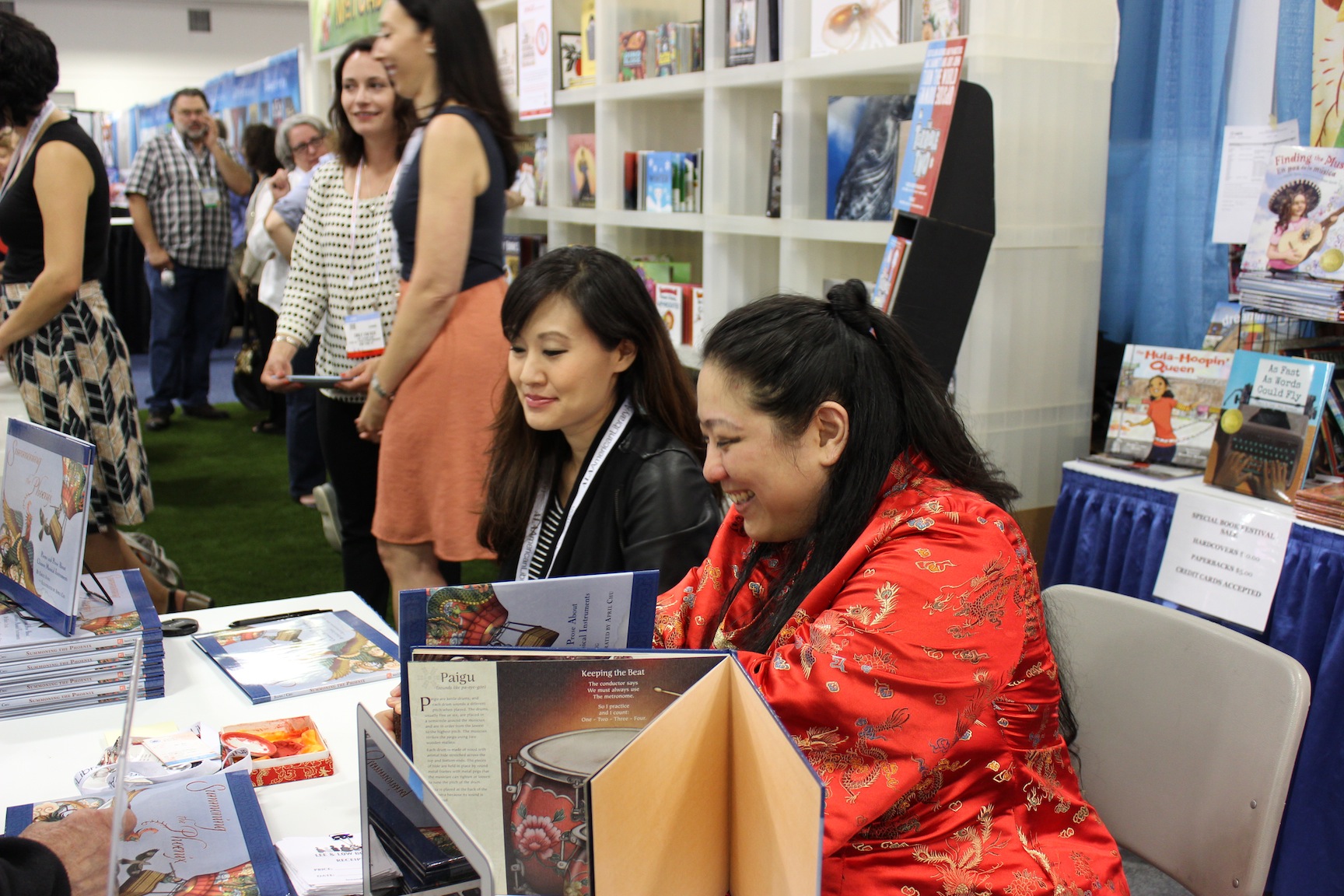 Me and Emily Jiang signing copies of our books at the Lee & Low Books Booth.