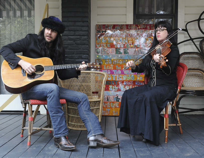 Music on the back porch of the original Victorian house. Sooooo Austin!