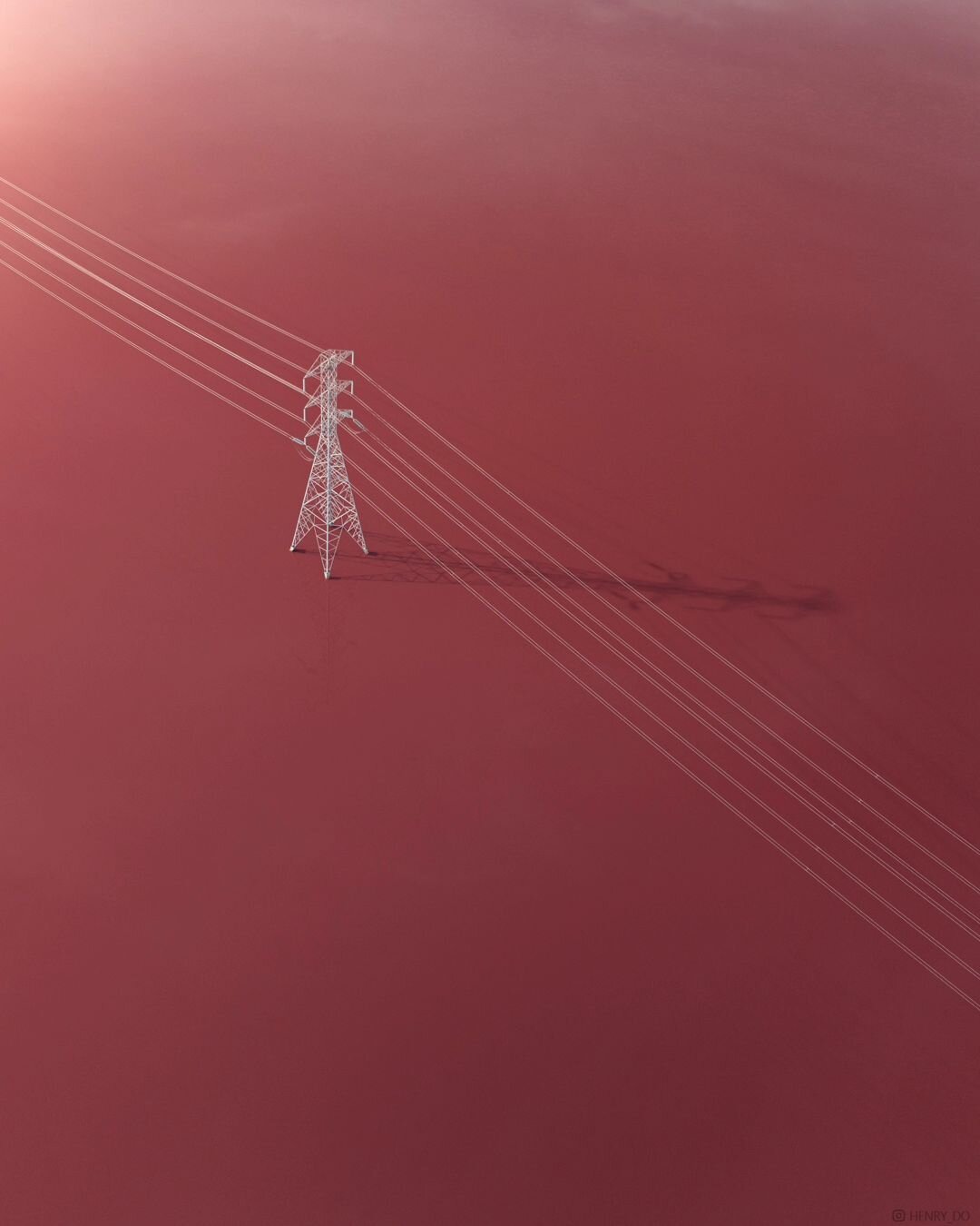 🗼⚡&mdash; Contrast meets tranquility. Multiple high voltage transmission lines pierce the calm canvas of man-made salt ponds, capturing the essence of minimalism in the juxtaposition of industrial strength and natural serenity.
