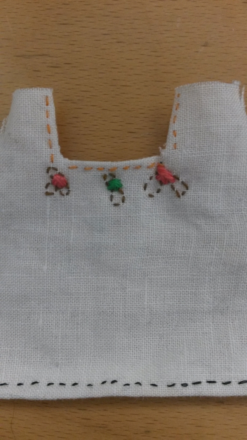 hand stitching the huipil