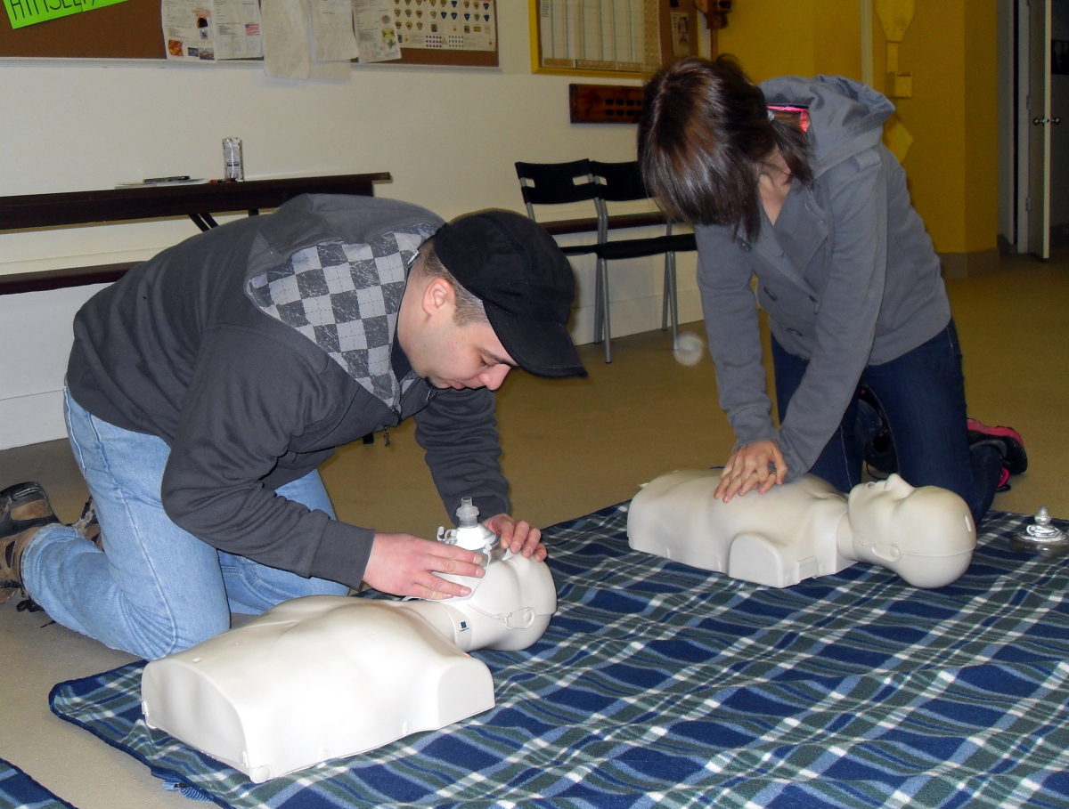 2 practicing CPR