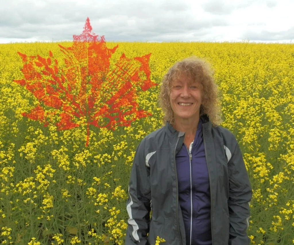 Me with Cdn Flag in Canola Crop.jpg