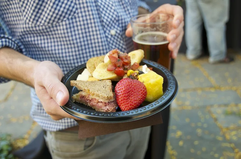 Finger foods, including a mini Reuben sandwich.