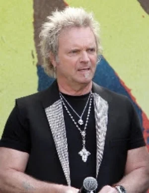 Joey Kramer of Aerosmith never takes off his D&A Rosary silver cross necklace!