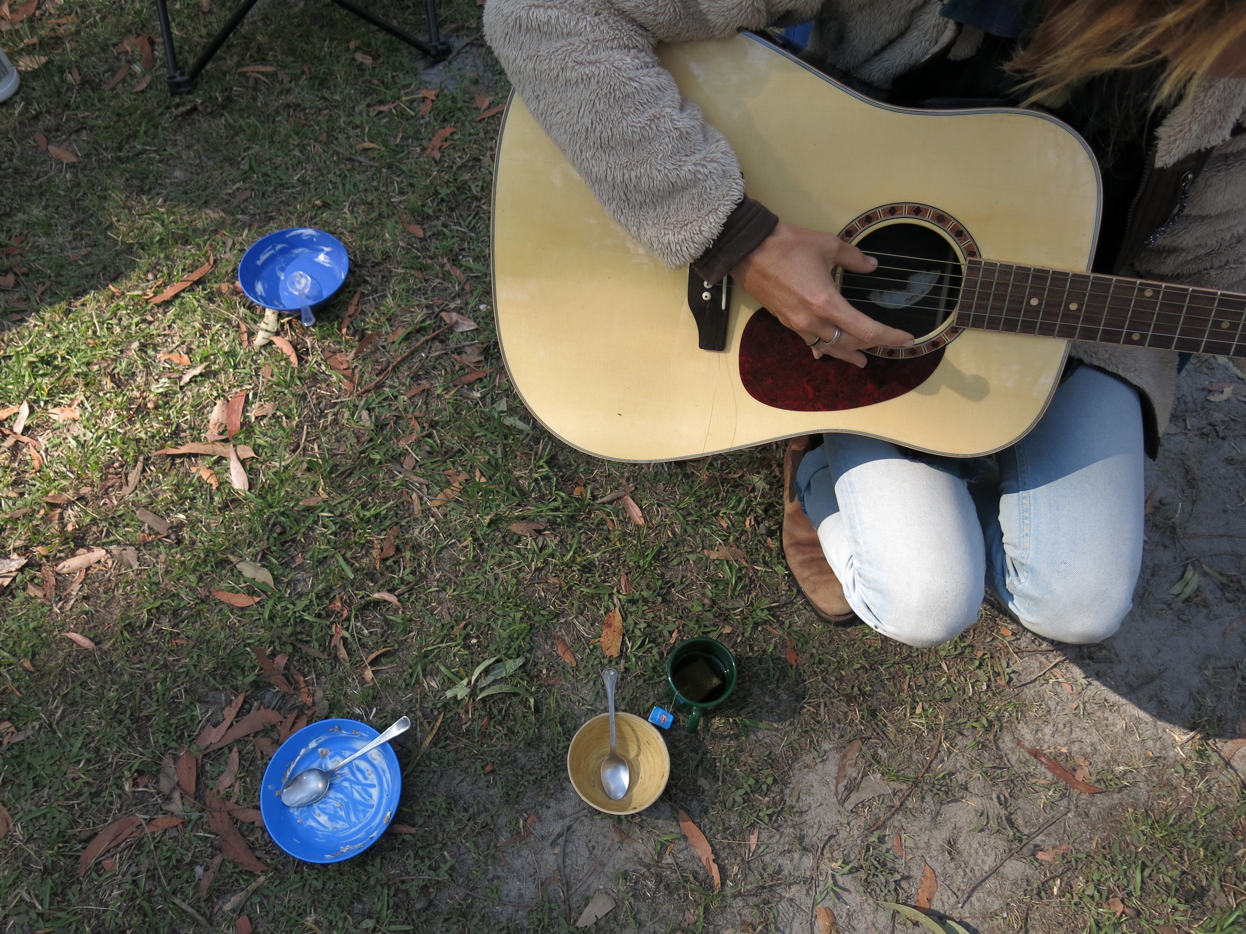 Breakfast aftermath and Carina on the guitar