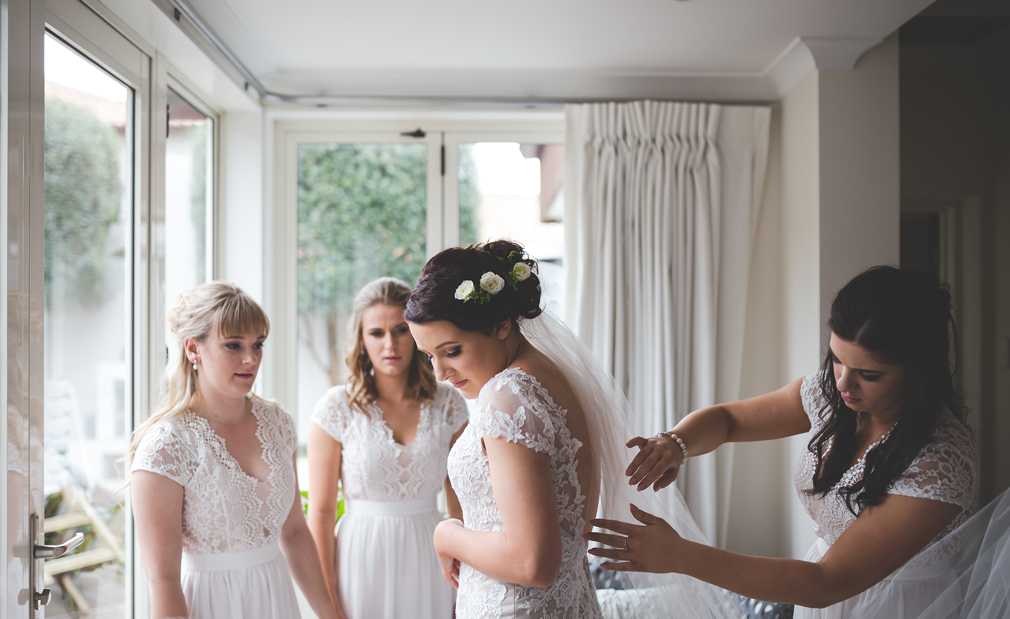 The ladies help Kristina with the final touches.