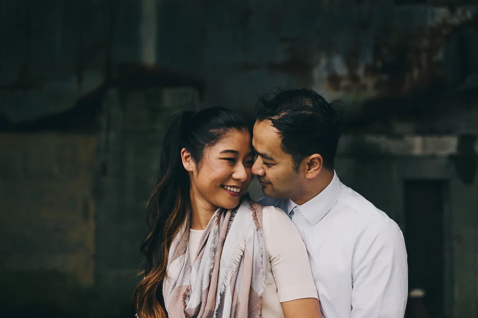 Sarah + Neth, having some snugs away from the elements.