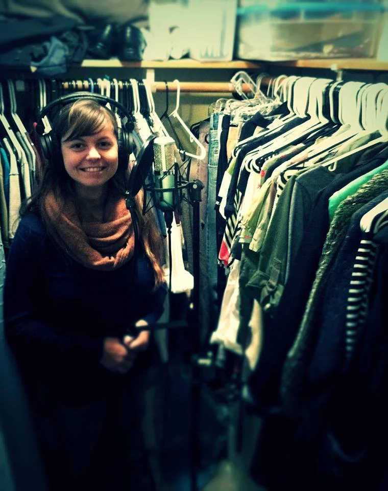 Mrs. Something showing off our elite vocal isolation booth: our closet.
