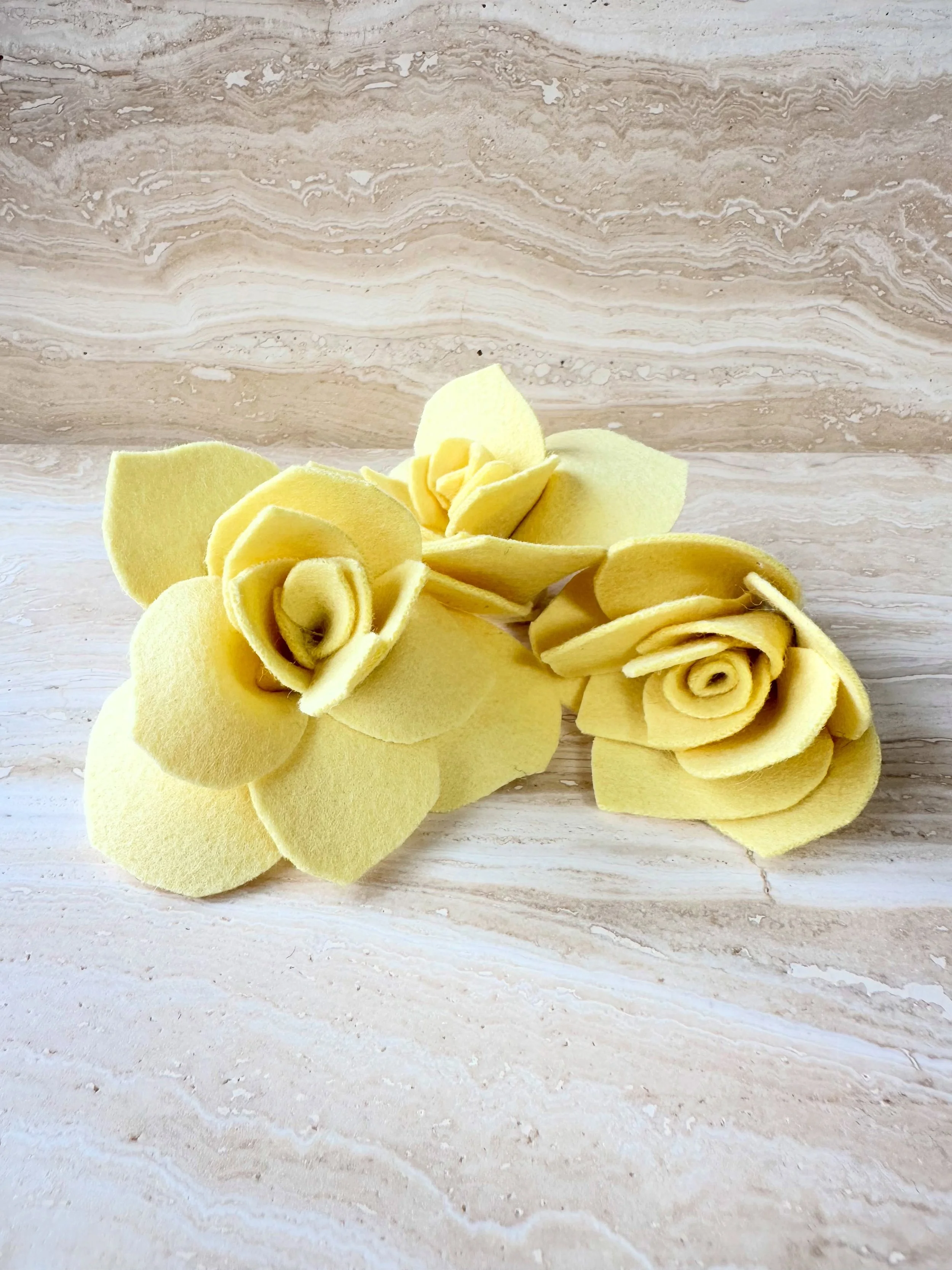 My little yellow roses make me so happy. I hand sew them sewn / sculpt them with wool fabric. Each rose becomes its own unique shape as I&rsquo;m sewing and creating the form. No two are alike, some go so smoothly while others take three times as lon