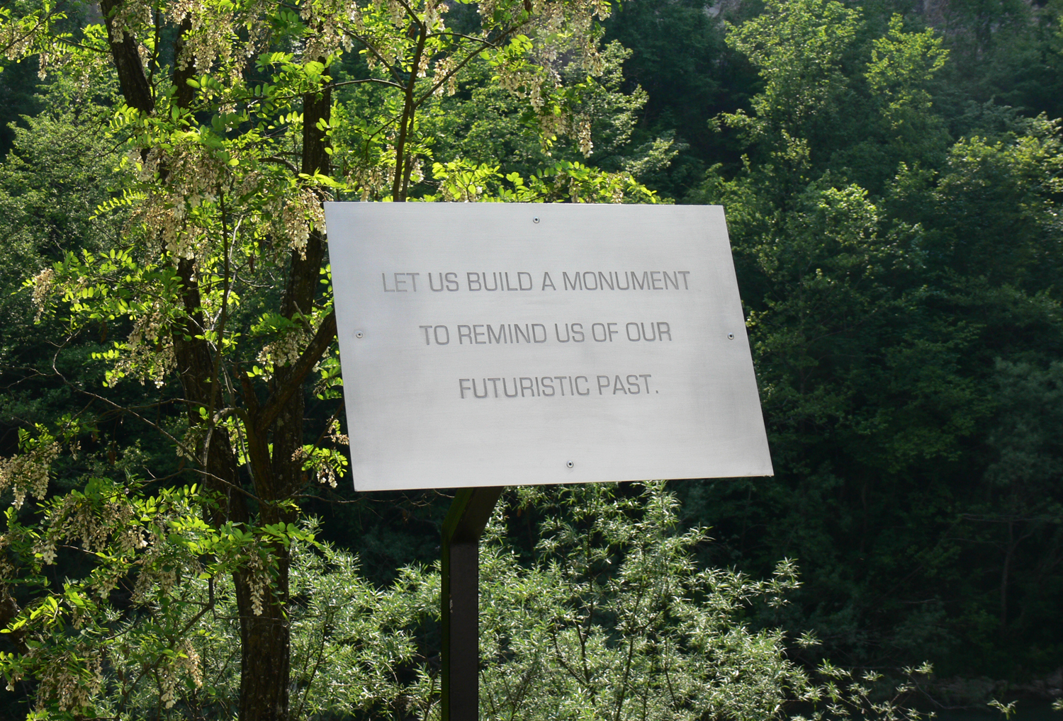  A Sign For Remembrance, 2011, engraved aluminum and steel. 125 x 50 x 35 cm. Installation view 1st Time Machine Biennale of Contemporary Art. D-O ARK Underground, Konjic, Bosnia and Herzegovina 