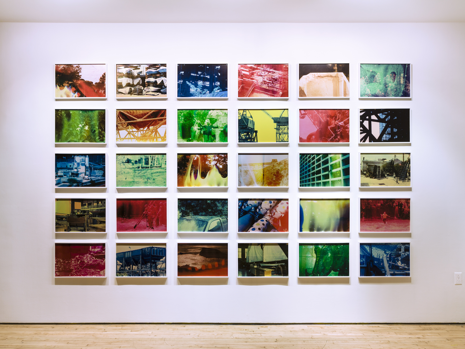 The Hollow Desire to Populate Imaginary Cities, 2014, 30 C- Prints from chemically altered slides on metallic paper, 34 x 50 cm each, Edition 3 + 1AP Installation shot of Exhibition at Art in General , NYC, 2014- 2015.