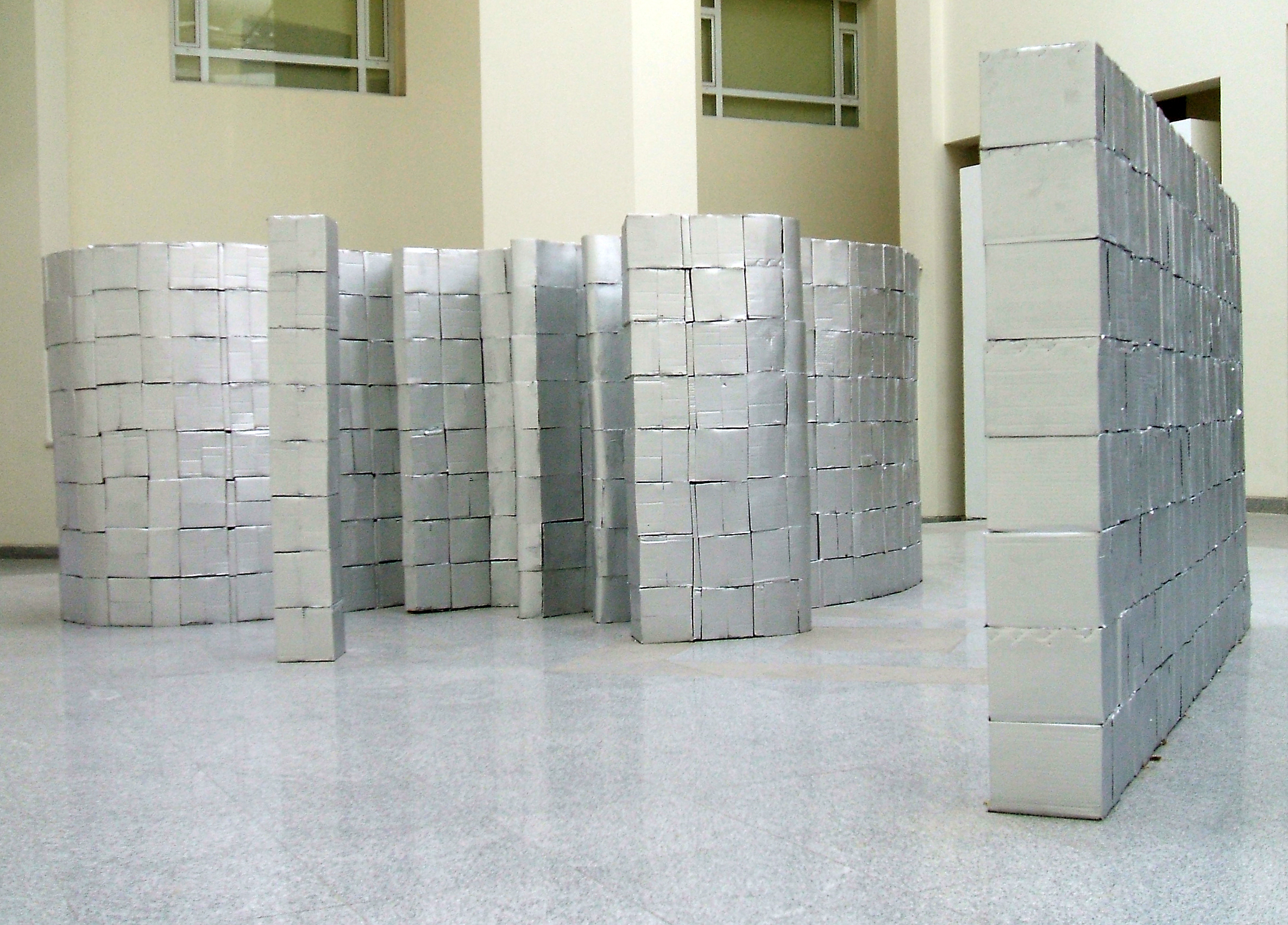  Sona El Seen - Made in China, 2009, 1500 Cardboard boxes construction silver colour, 1200 x 80 x 180 cm. Courtesy of the artist and Gypsum Gallery. 