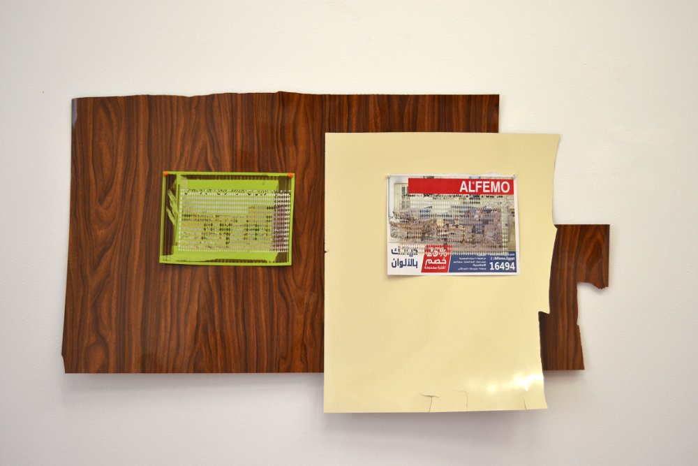  Untitled (Al Sharq Al Awsat), part 1 and 2, 2015/16, materials: Plastic laminate, newspaper on paper, newspaper on magazine advertisement, pins (installation view), variable dimensions. Photo: Nile Sunset Annex. 