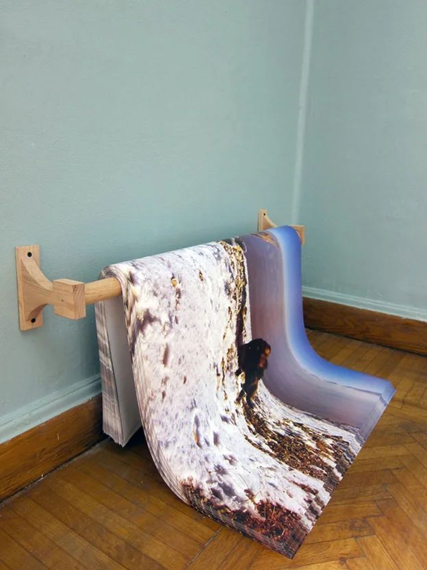 Please Stay Blurry, 2013, Offset print, 100 x 70 cm giveaway poster, edition of 500, wooden rod installed close to the floor. Installation view, Nile Sunset Annex, Cairo, Egypt.