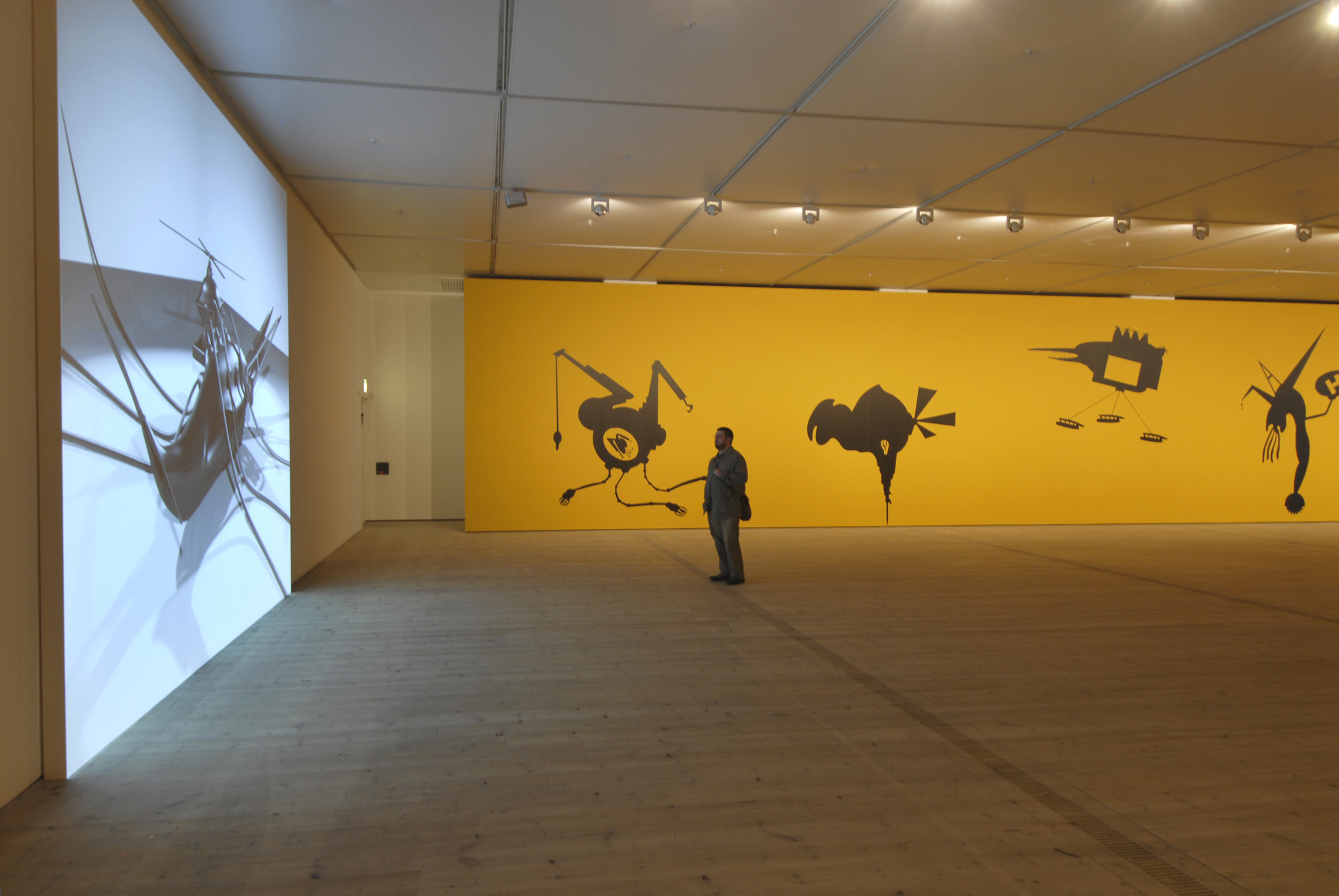  The Bride Stripped Bare by Her Energy's' Evil, 2006, two large scale wall paintings (10 m each + acrylic colors), audio elements and a projected short 3D animated film, 2 min. 44 sec. Installation view at BALTIC Centre for Contemporary Art, Gateshea