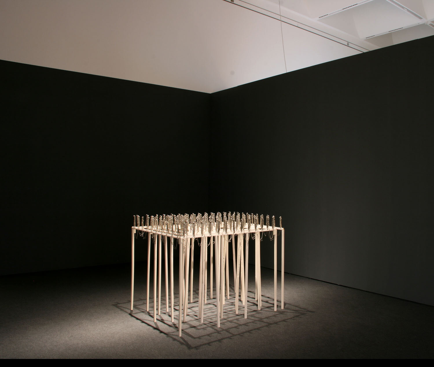  Masha Labyrinth, 2006, installation of stainless steel masha dolls and wood, 180 x 210 x 2 cm 