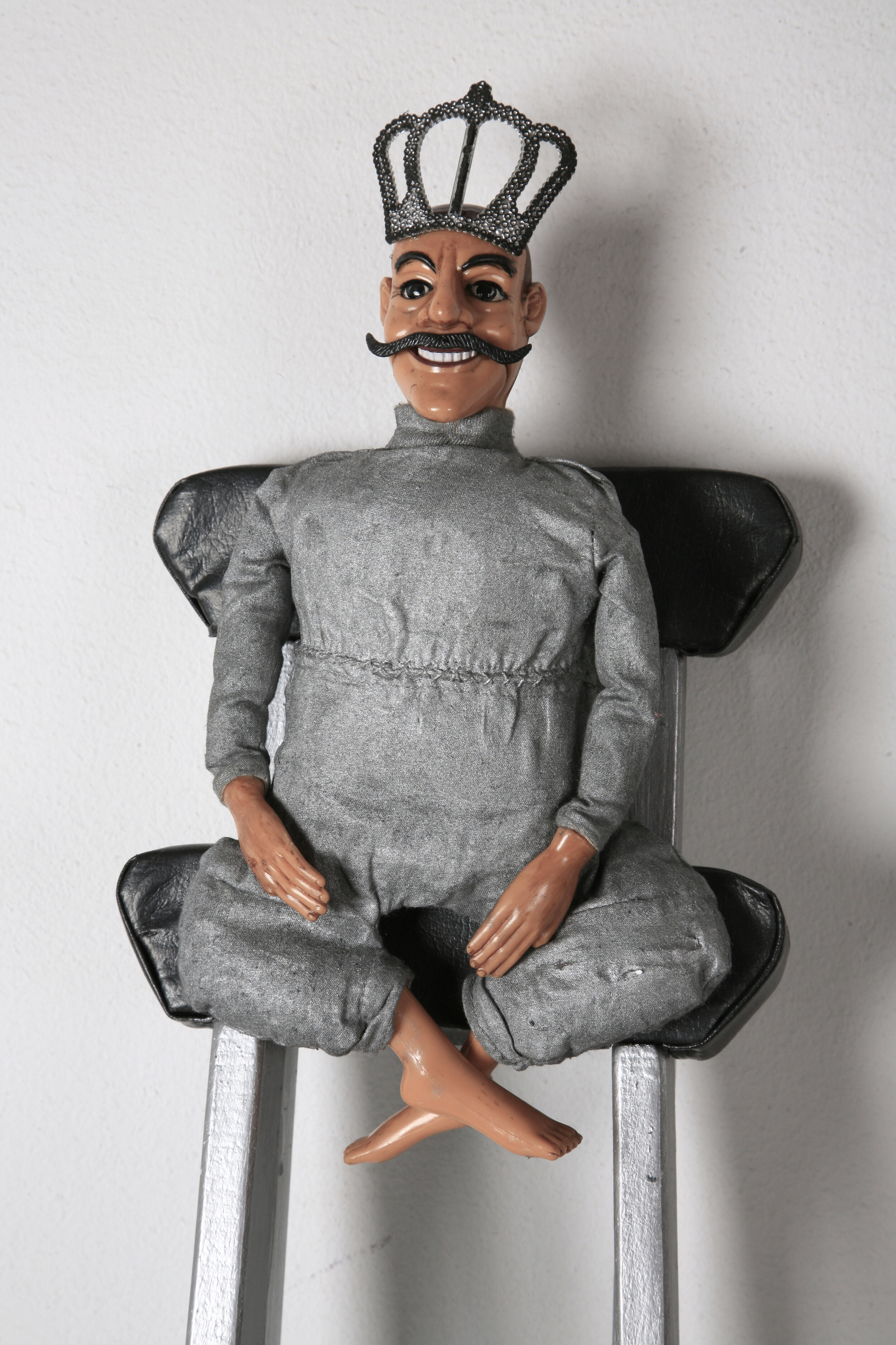  Elusive Kingship (detail), 2010, recycled plastic doll, wooden crutches, acrylic paint, 105 x 16 x 5 cm 