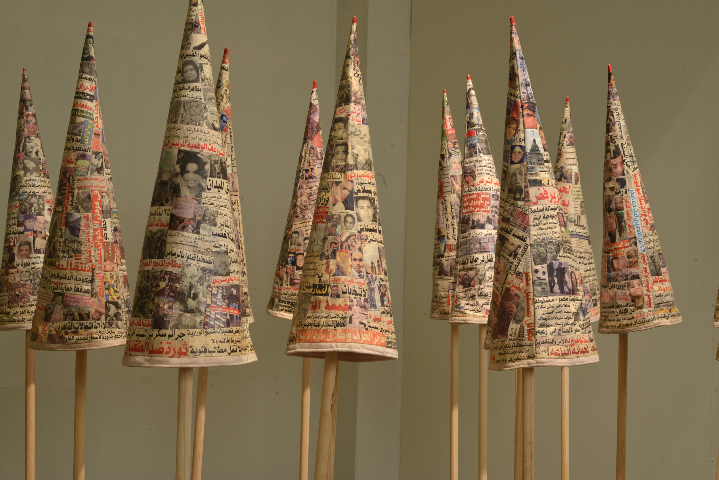  The Fool’s Journal (detail), 2013 - 2014, installation of newspaper cut-outs on fabric, wood, 17 pieces, 52 x 19 cm diameter (each) 