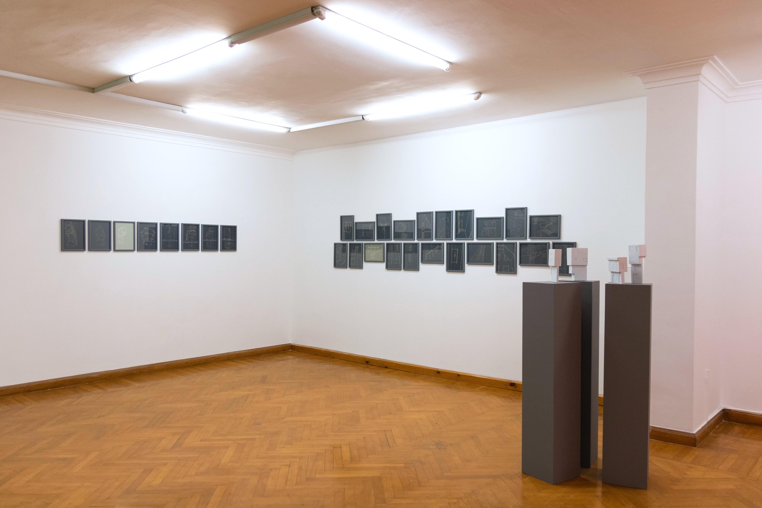  Installation view - How To Build a City With Two Nails and a Wire (2022). A series of Acid on colored paper drawings, 29 x 21 cm each. 