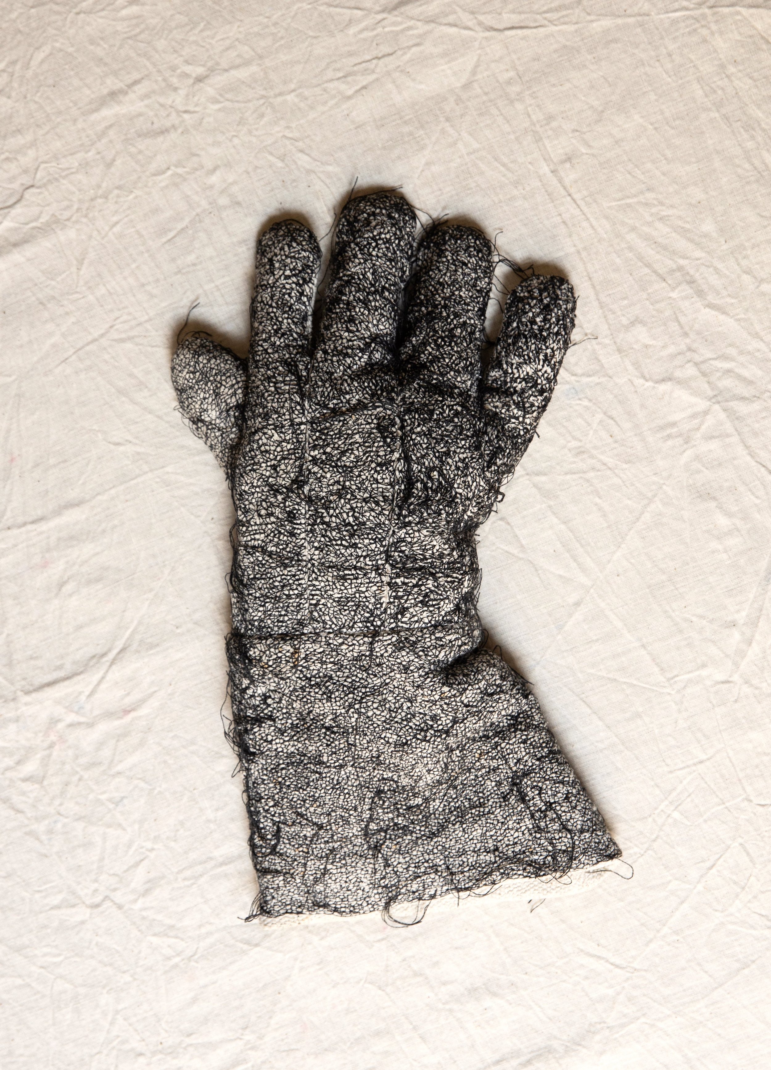  Worker’s Glove, 2022, Found object, black thread, 38 x 16.5 x 2 cm.  