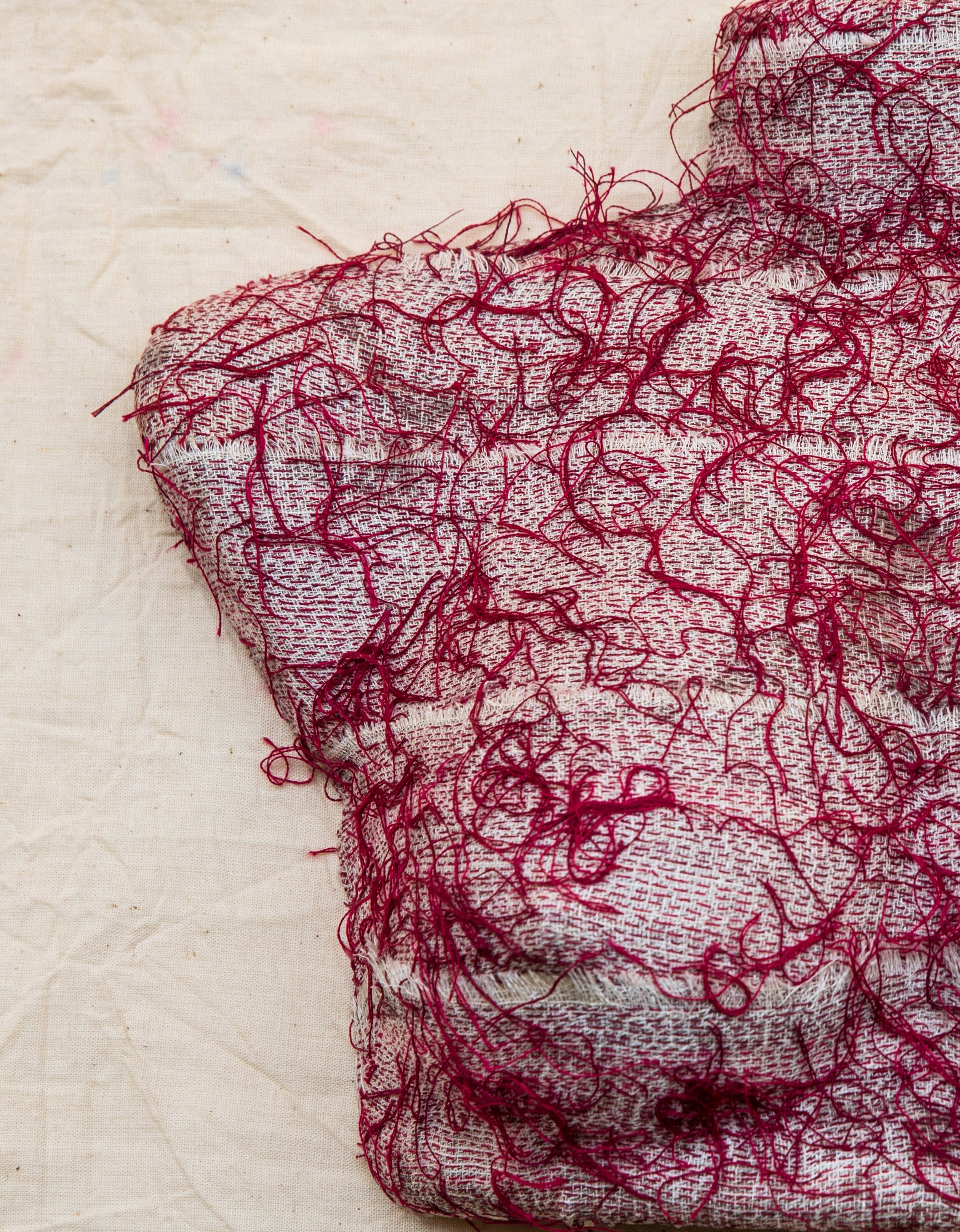  Entangled Emotions, 2022, Plastic bust, fabric, red thread, 49 x 39 x 12 cm.  