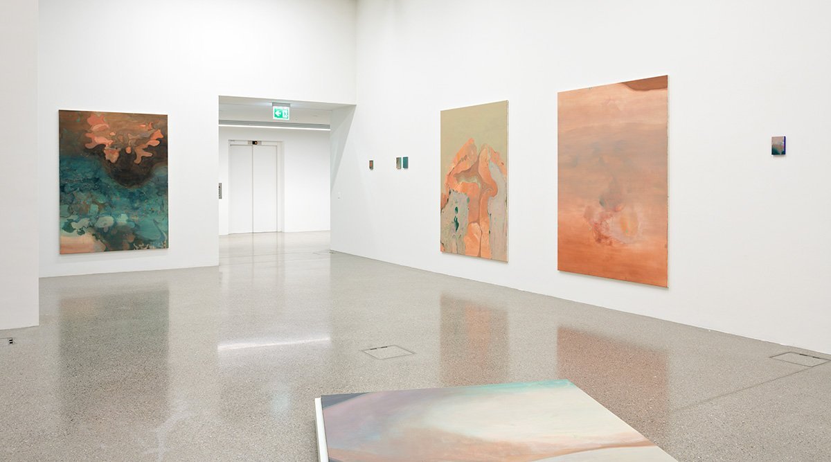 Exhibition view of Little inlets , Helvetia Art Foyer, Basel, curated by Nathalie Loch. Left side: Once in a blue moon (2023), acrylic on cotton, 180 cm x 130 cm and Little inlets (2023), various sizes, acrylic and shellac on wood.&nb