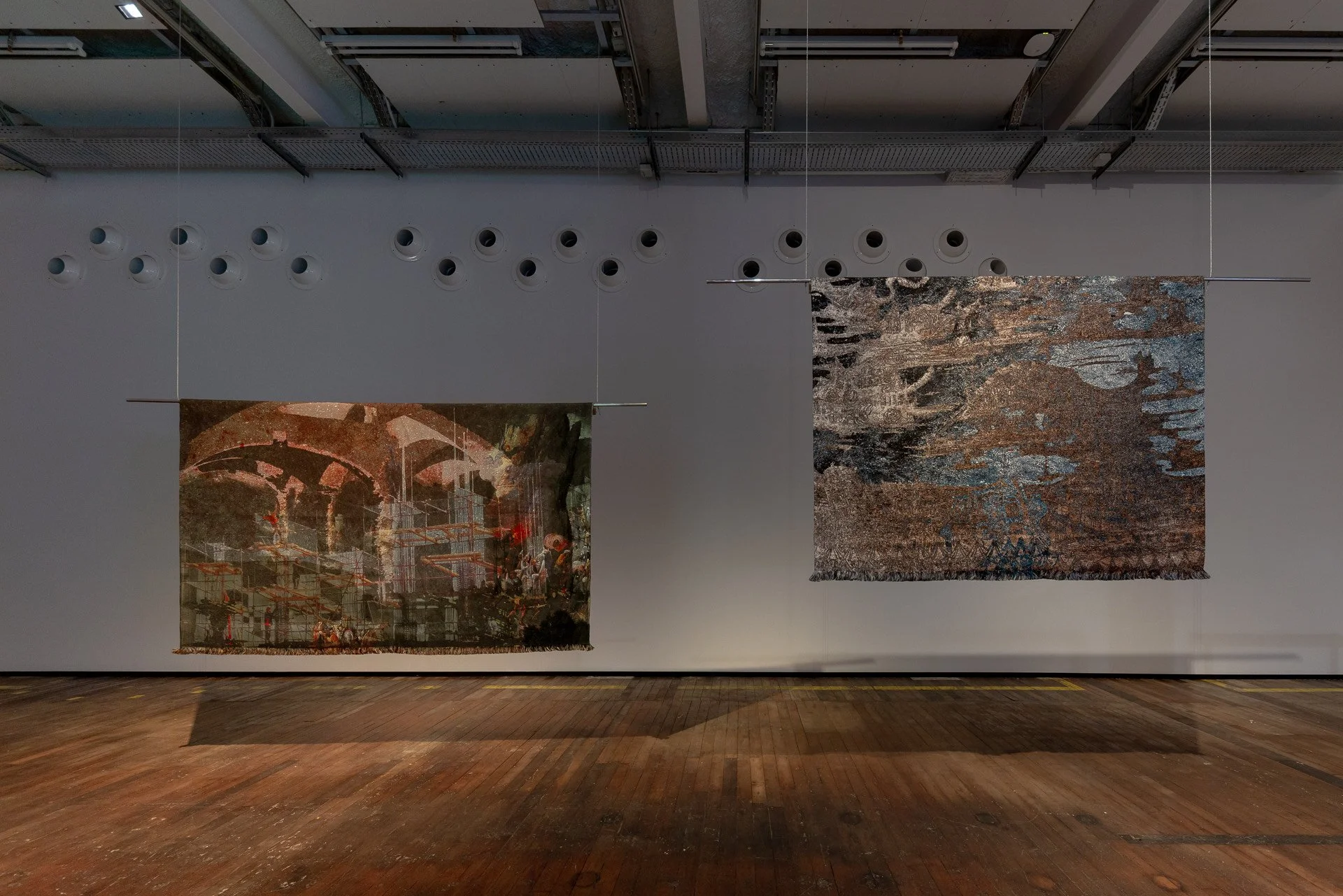  Installation view from  As Stones on Their Palms, Embers and Flame  group show at La Fabra Centre d’Art Contemporani, Barcelona  Right:  Resilience between Stone and Water , 2024, Jacquard-woven tapestry crafted from wool, cotton, and lurex, 150 x 2