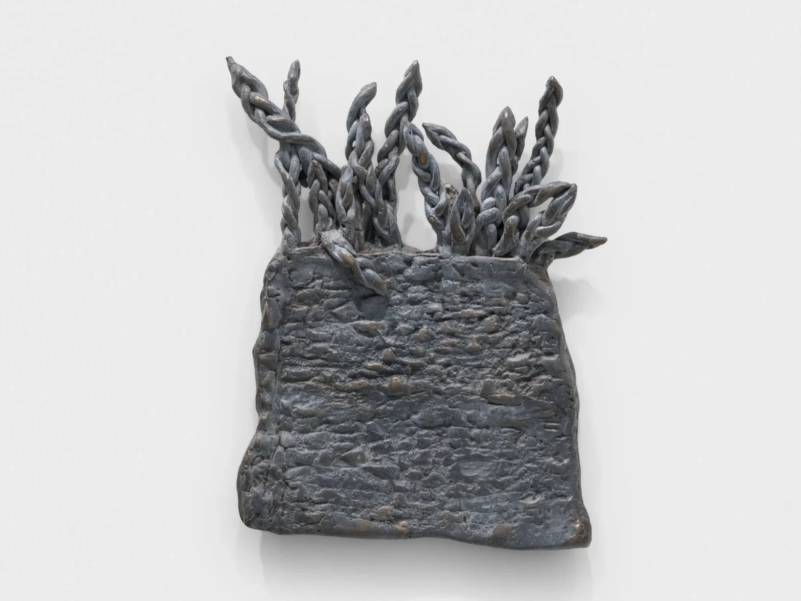  Installation view from Art Basel, Basel, 2026  Featuring  Plot Twist,  2026, cast bronze and grey patina. 27 x 20 x 2 cm 
