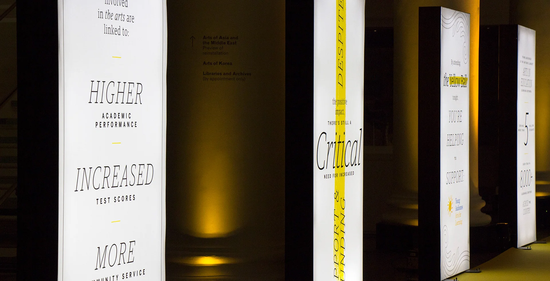 Guests walked past a series of light boxes that told the story of a dire need for arts education.