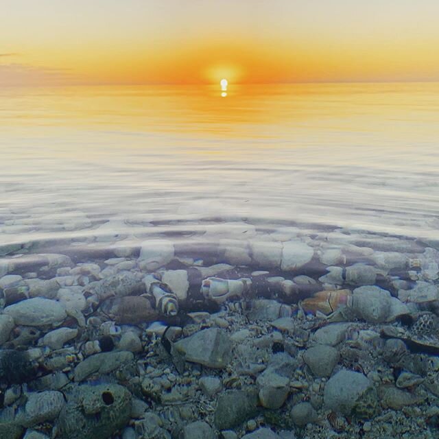 Tuesday, our last evening in Eleuthera, I stood on the shore of the Caribbean watching the sun set over the calm, crystal clear water.  That&rsquo;s when it hit me to try to take a picture that captured both the beautiful shells I was seeing through 