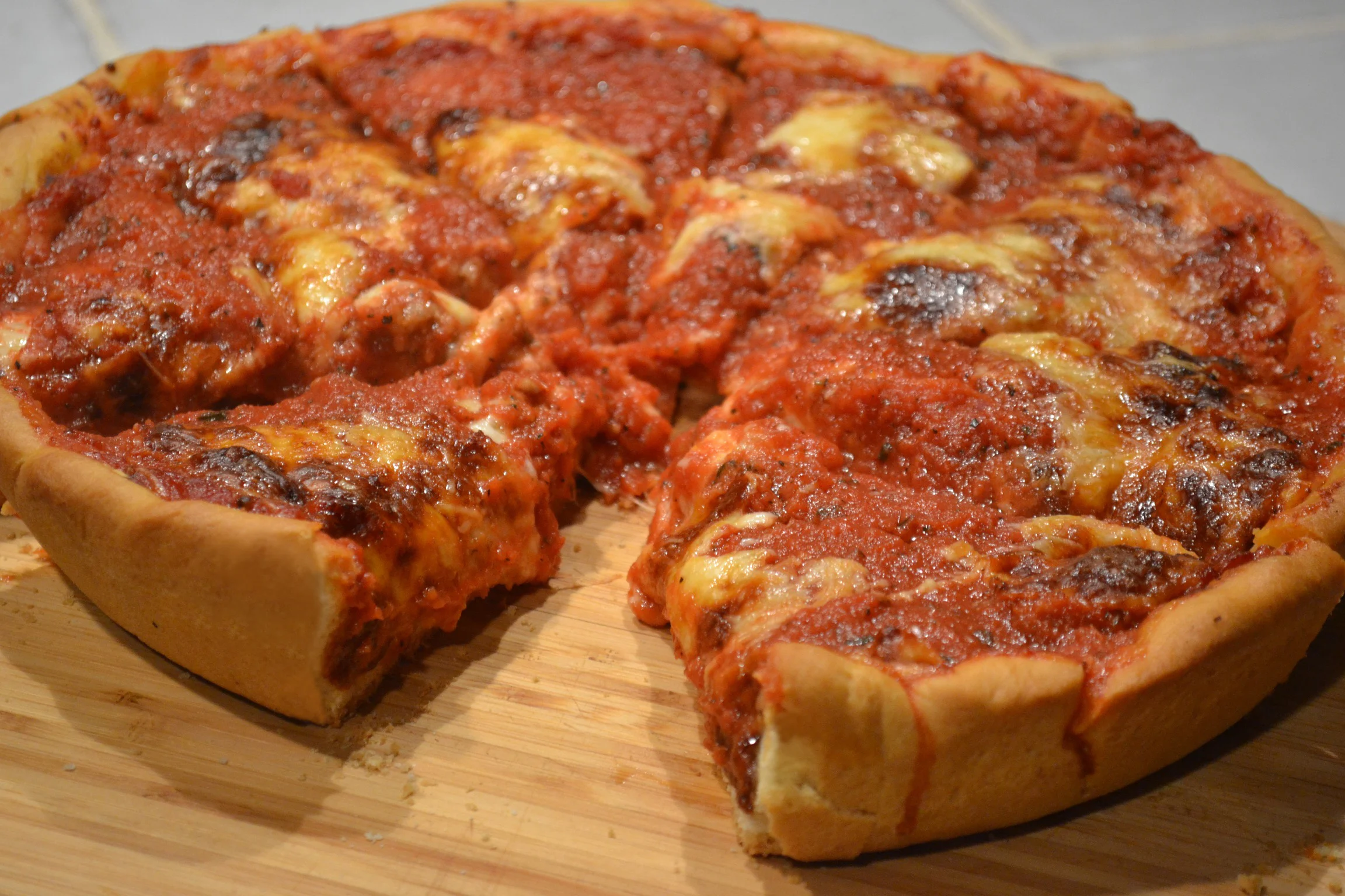 Authentic Chicago Deep Dish Pizza Cooked in a Cast Iron Skillet