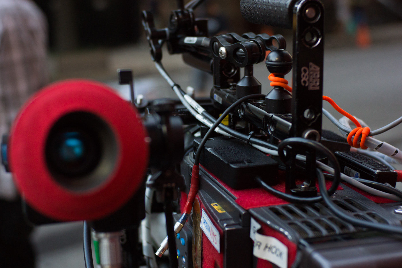 The transceiver is unobtrusively velcroed to the top of the camera under the handle.