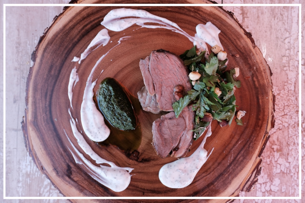 Temper the harissa heat with a splash of cool lemon herb yogurt and herbaceous parsley and hazelnut salad. Photo by @kevinwtackett.