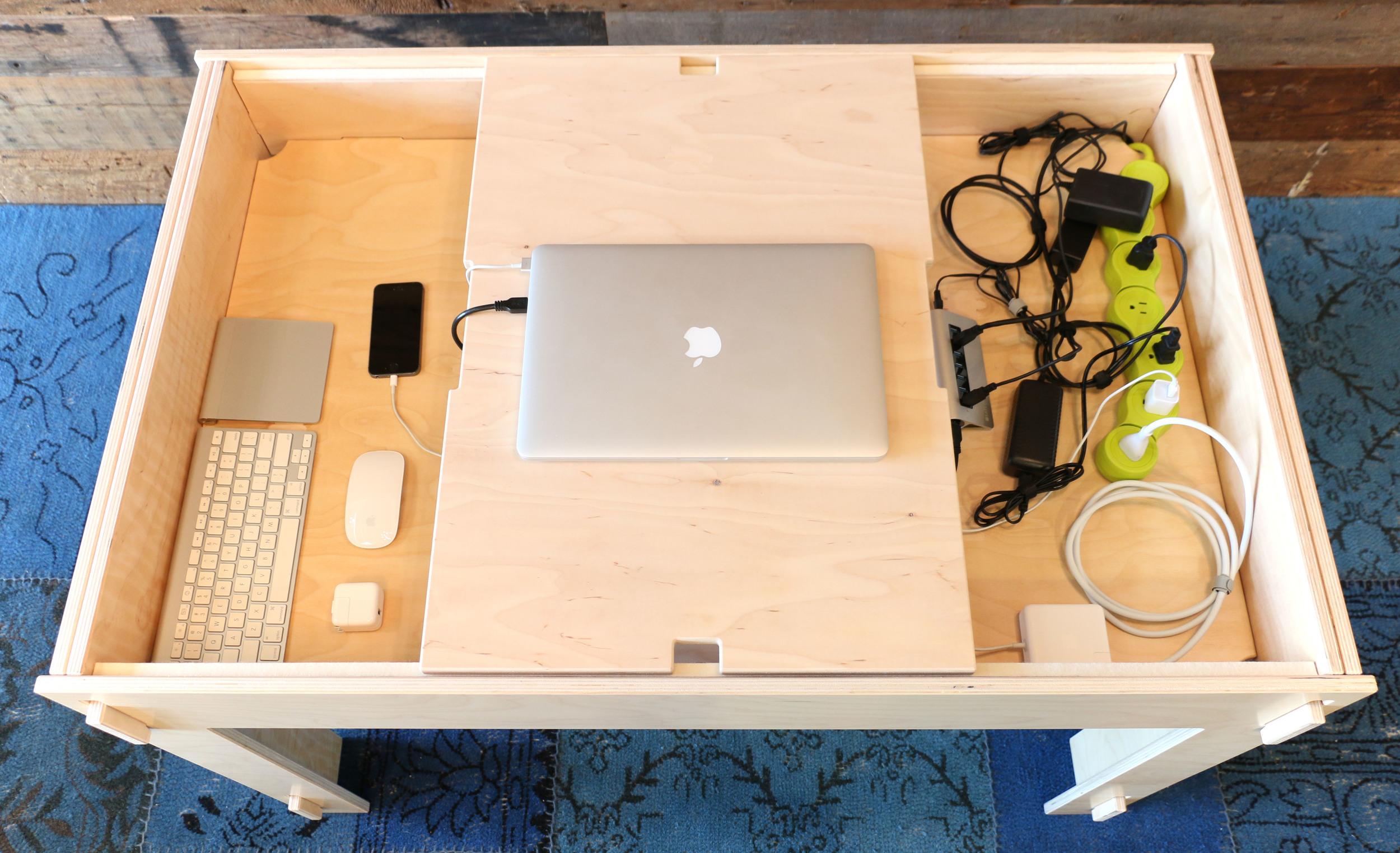 Peripherals and accessories like power strips and USB hubs can be completely concealed inside the compartment