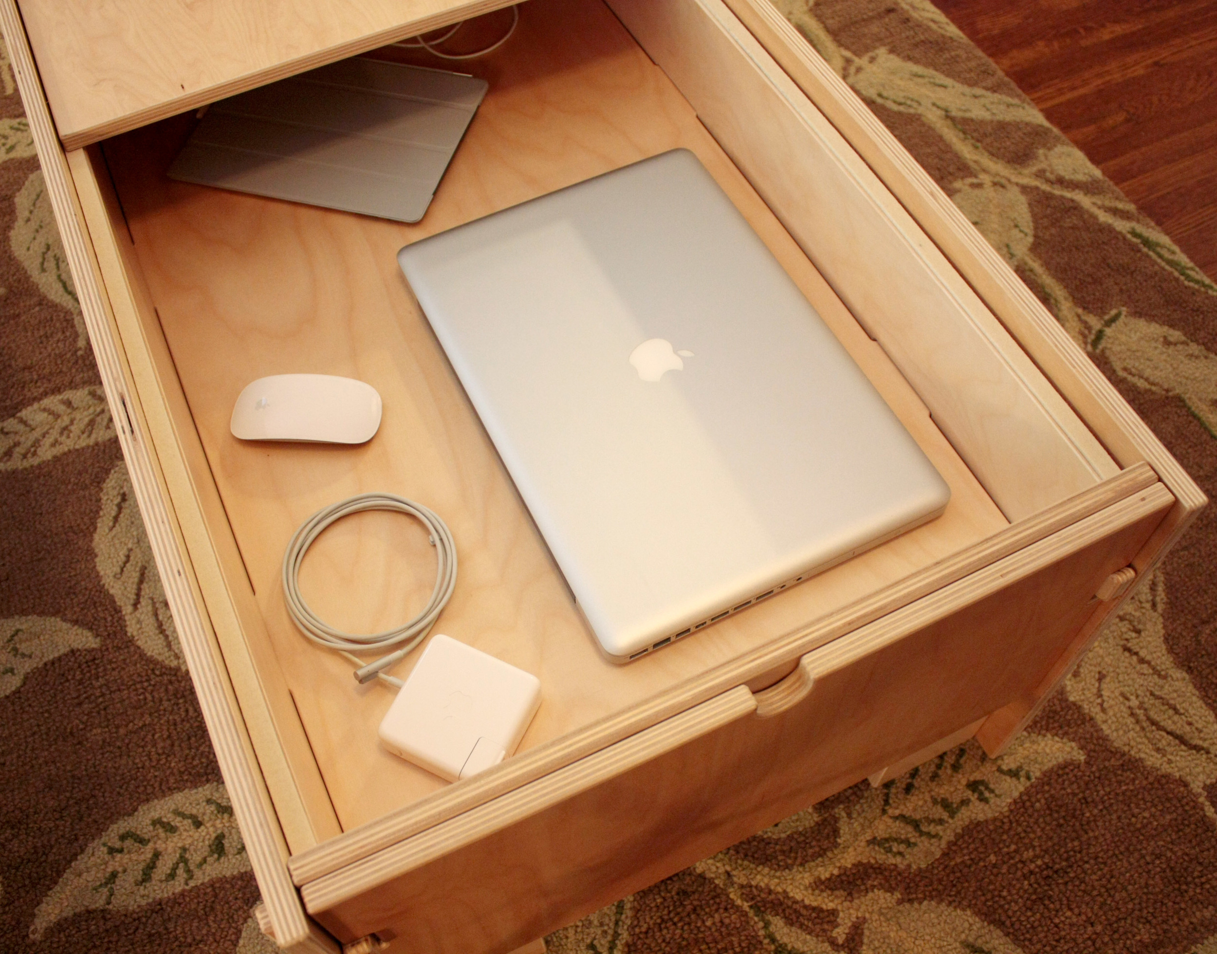  Storage Coffee Table with MacBook Pro and accessories 