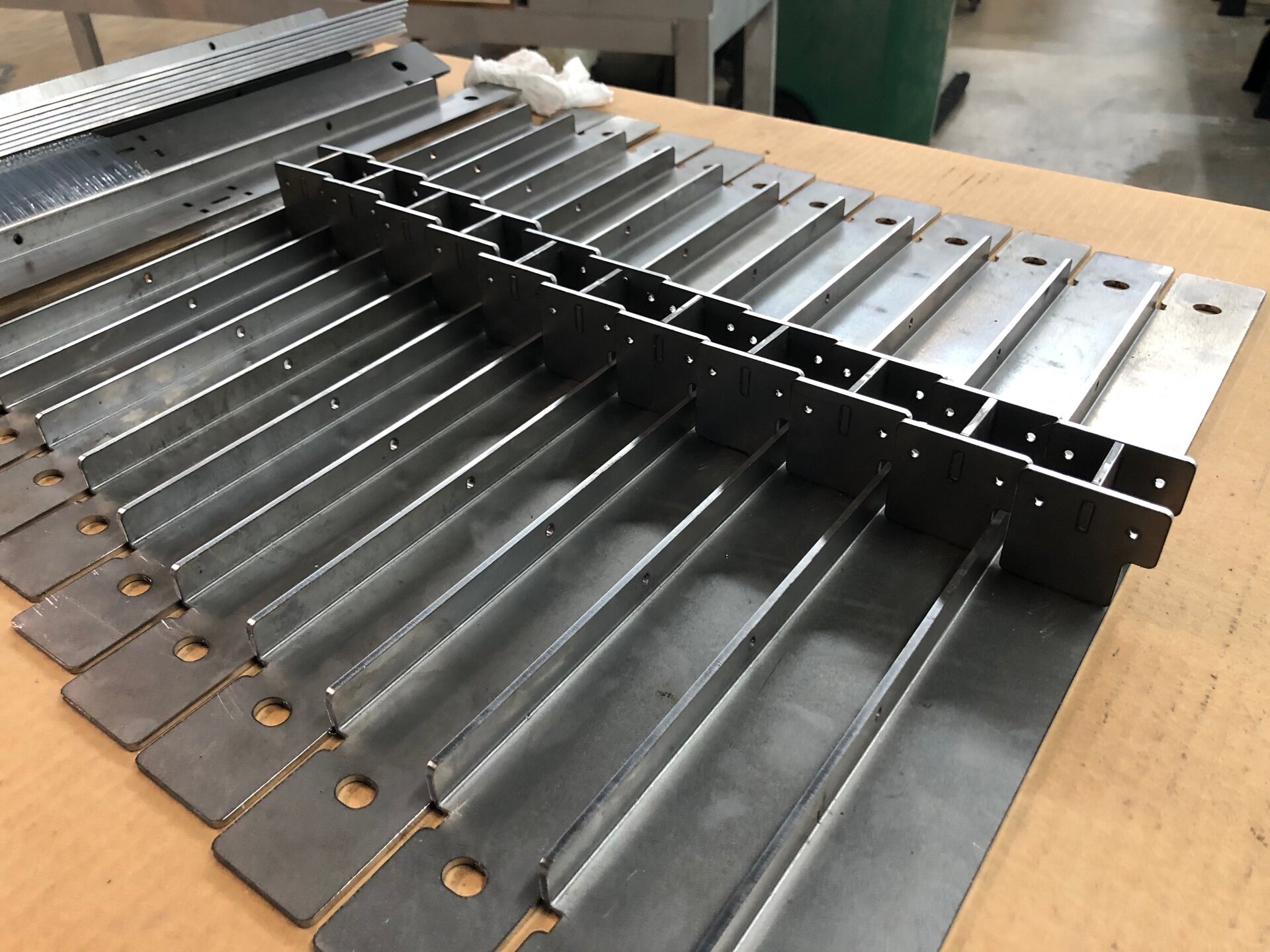 Welded steel crossmember pieces that support the flip-up doors