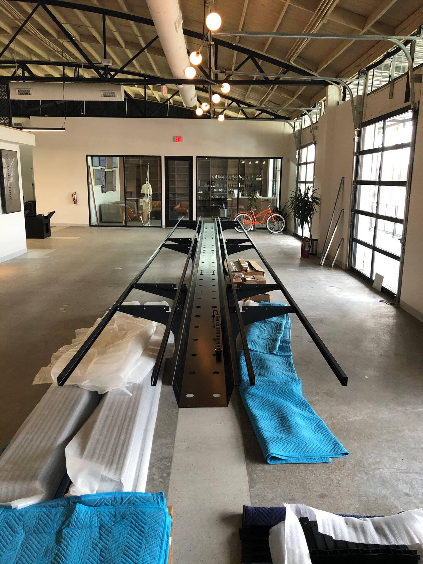 Steel bases and beams for a 36' table, during assembly