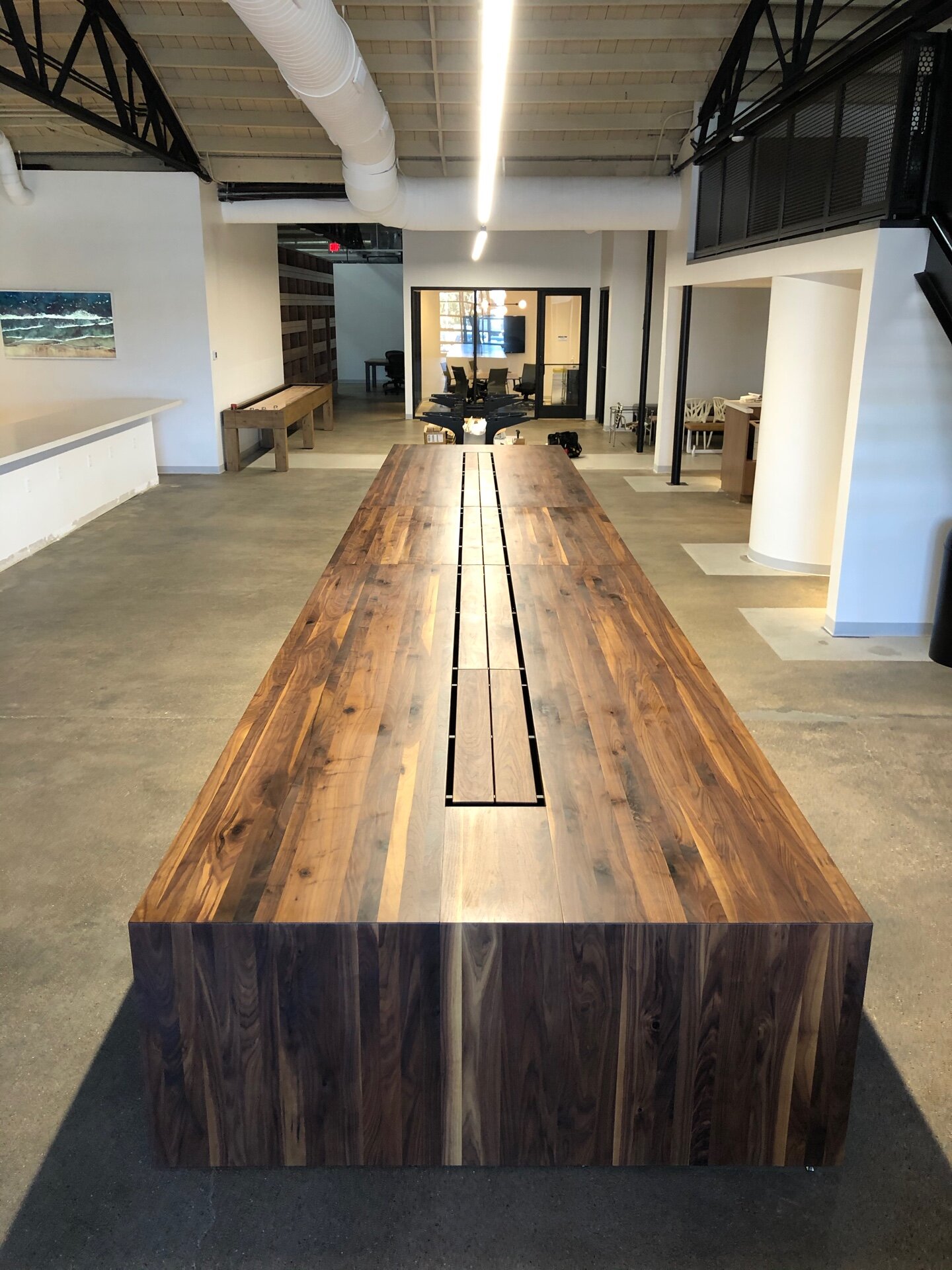 30' Walnut Waterfall Table with another 22' table in the background