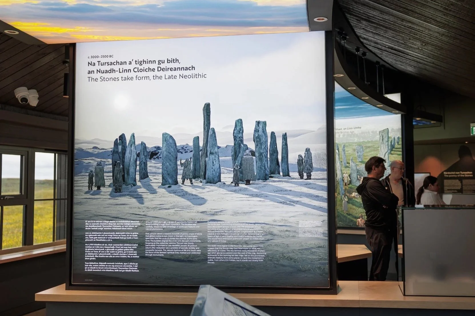 Visitor Centre exhibition panel about the Late Neolithic Callanish Standing Stones, featuring an illustration of people among tall stone monoliths.