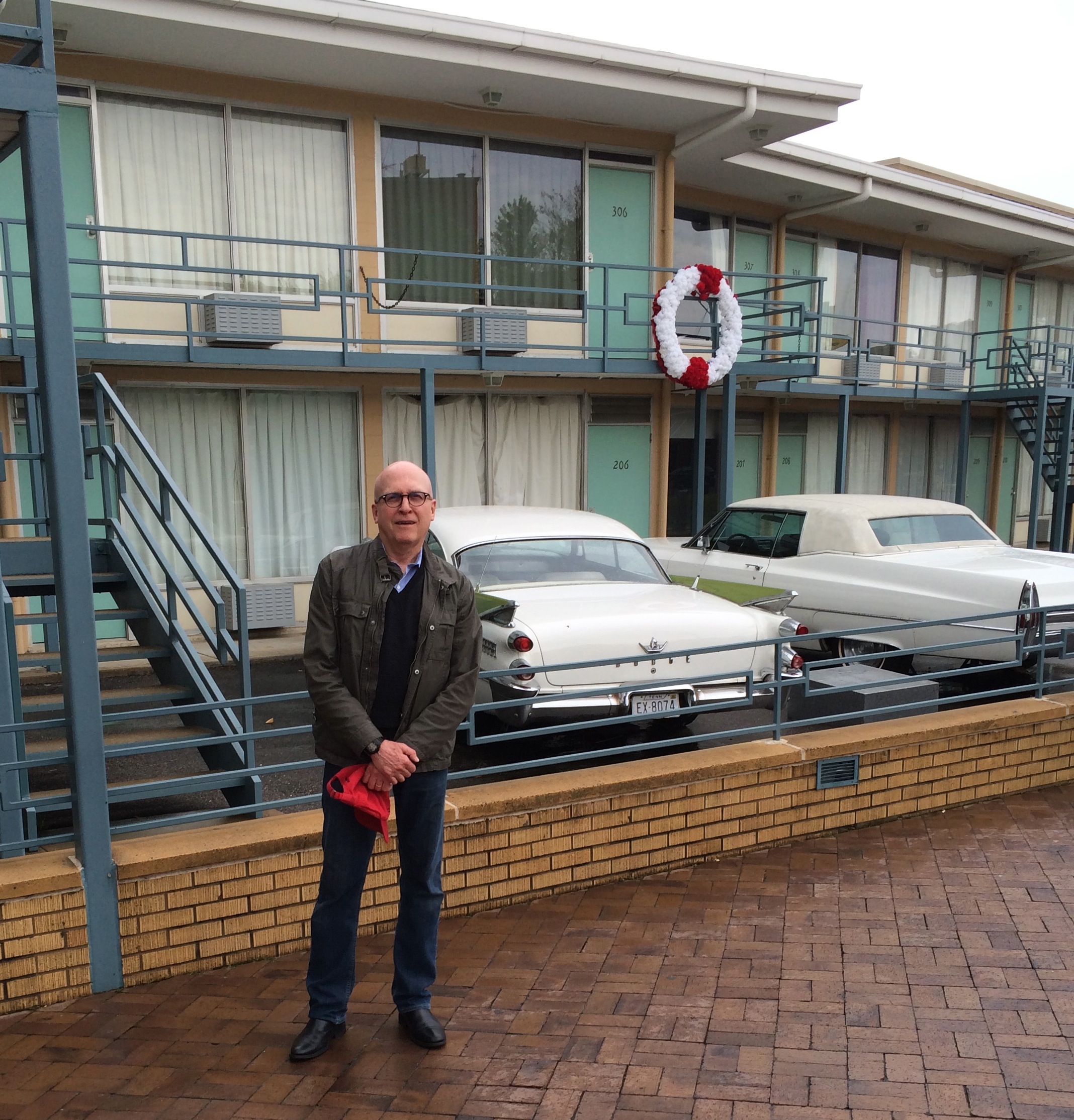 The white wreath commemorates the spot where Martin Luther King was standing when he was shot. His room, 306, and the adjacent room are intact, while the rest of the motel's interior space has been given over to the museum exhibit area. The two cars are replicas of those that were parked at the motel at the time of the shooting.