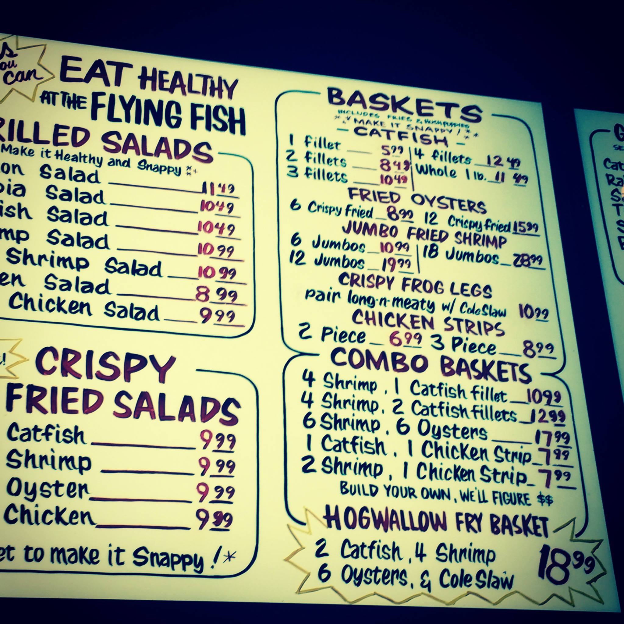 The menu at the Flying Fish in Downtown Little Rock, Arkansas. Catfish, frog legs, fried oysters and hush puppies. Definitely, my kind of road food.