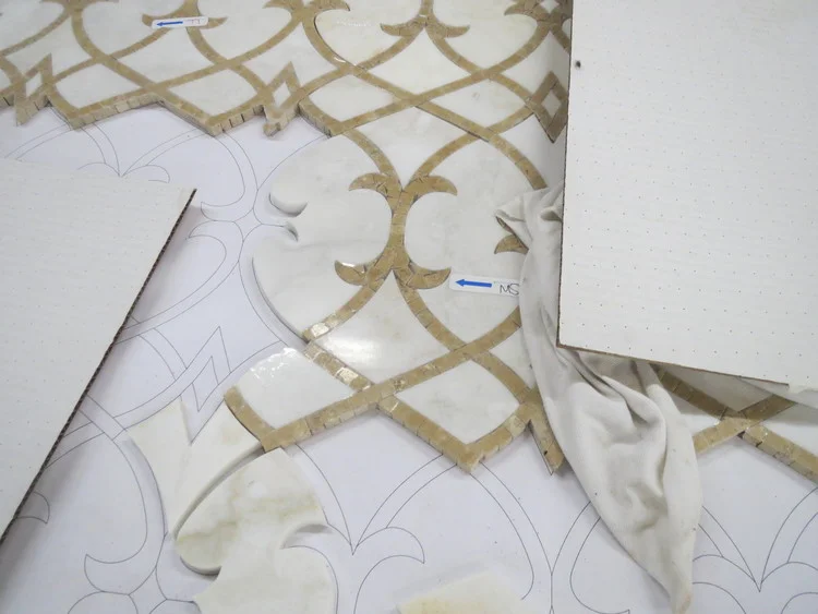 Waterjet cutting allows smooth, flowing lines to be incorporated into mosaics.