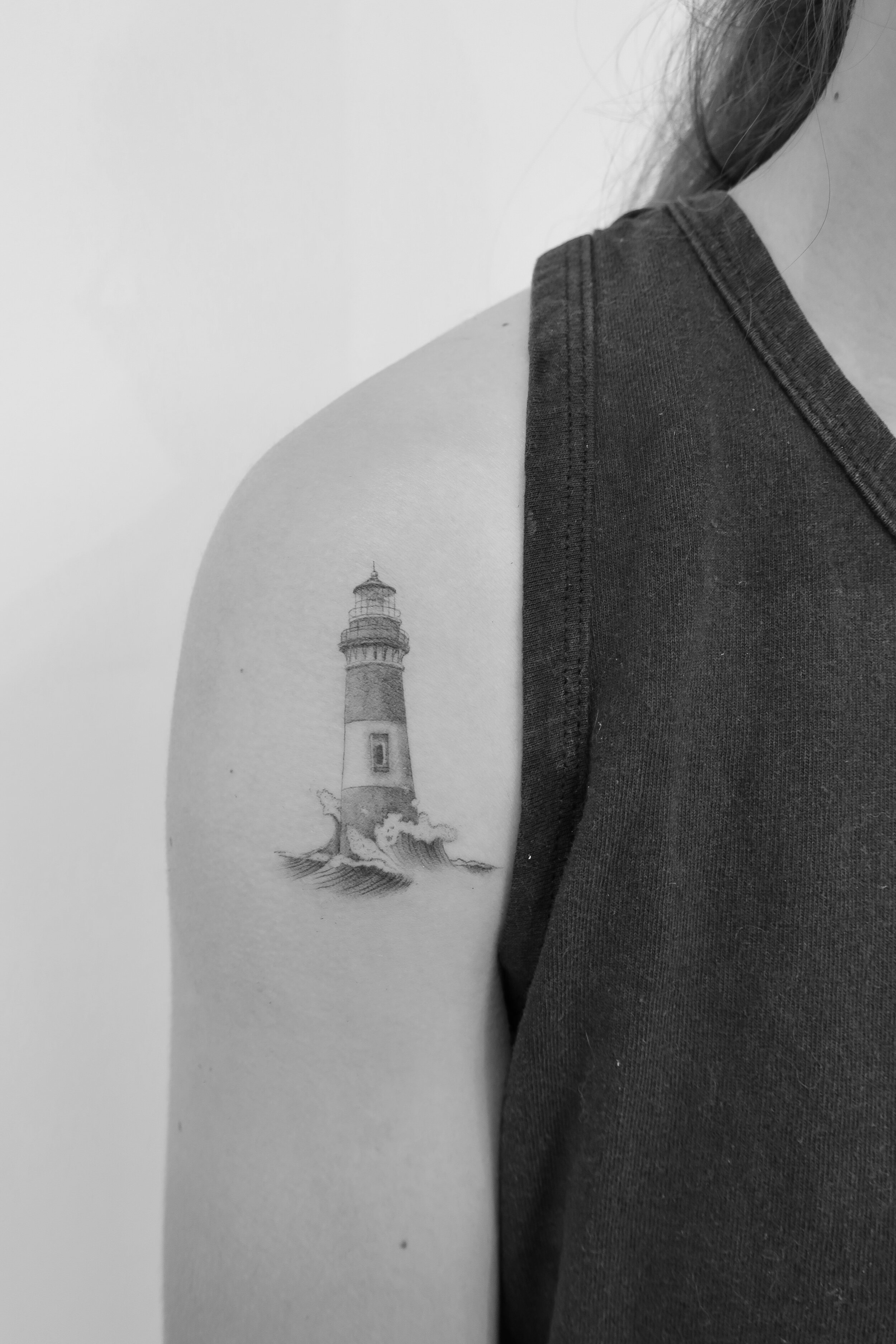 Lighthouse tattoo on the shoulder blade  Tattoogridnet