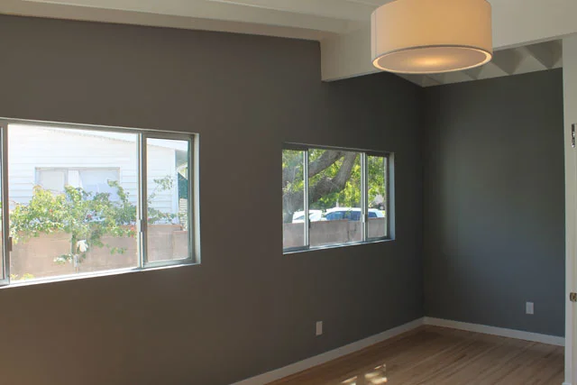 While this picture isn't great, you can see the new windows, and the hardwood flooring. You can also see that I added the beamed ceilings in the master bedroom. Lastly, I reconfigured the floor plan to allow for a sitting area in the corner of the room where the ceilings are at their highest point.